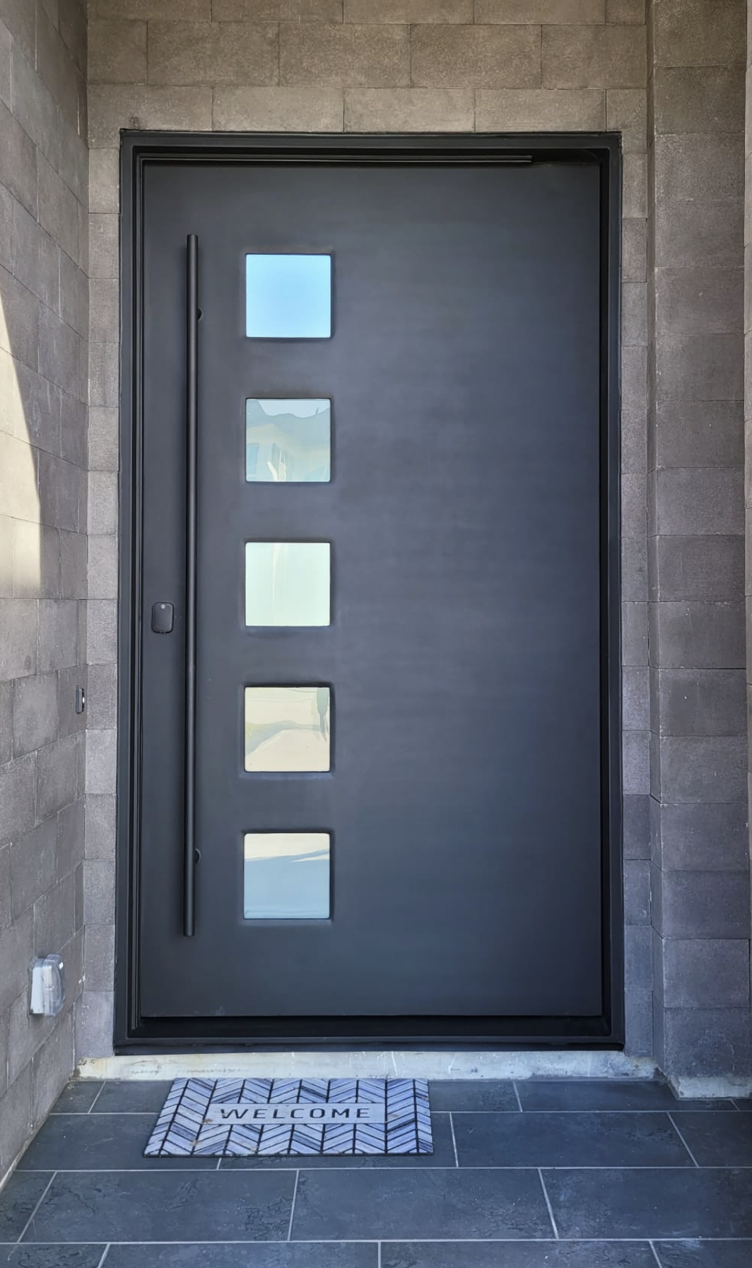 Oversized iron pivot door