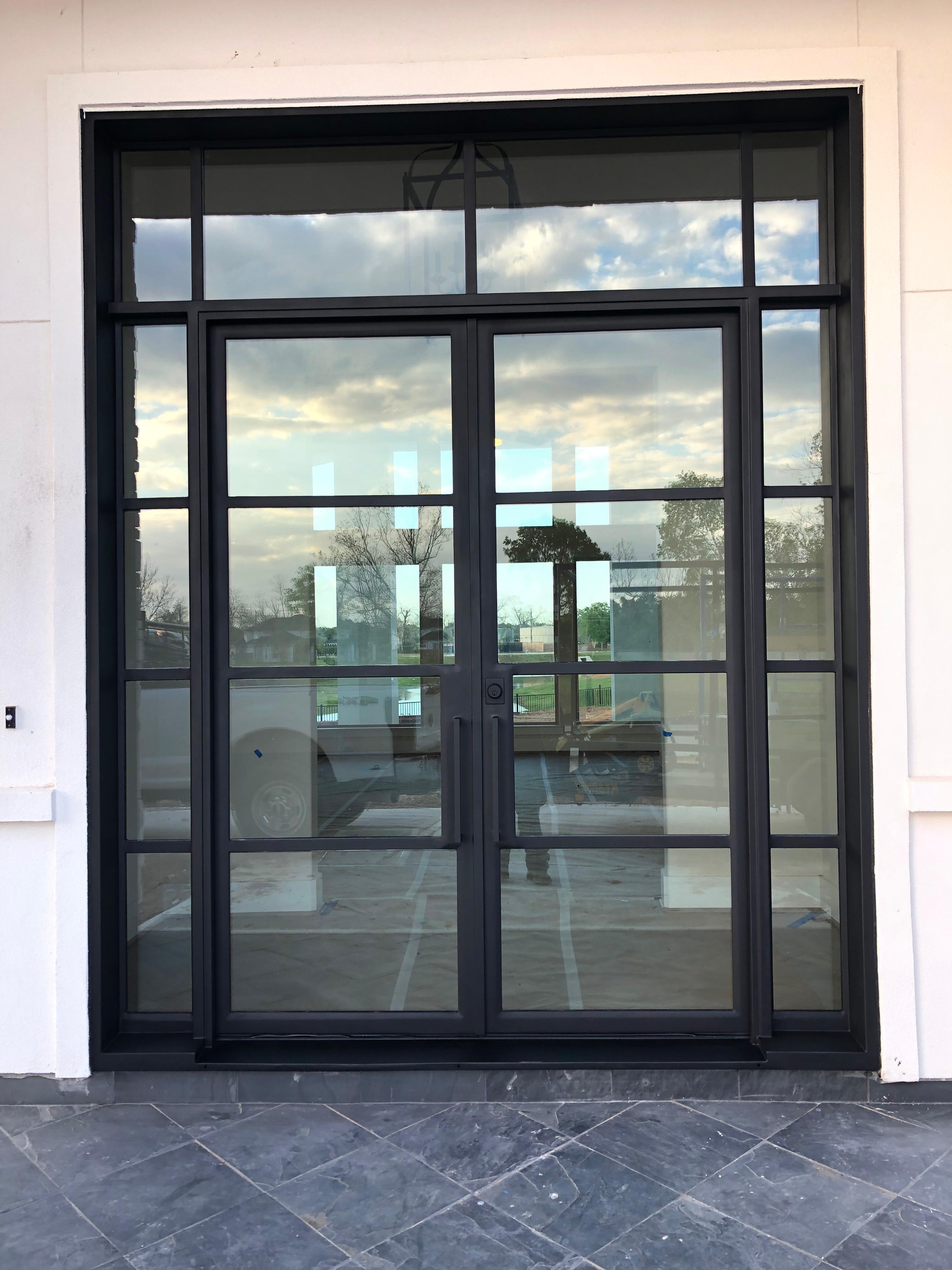 Grand iron double door with sidelights and transom, Houston