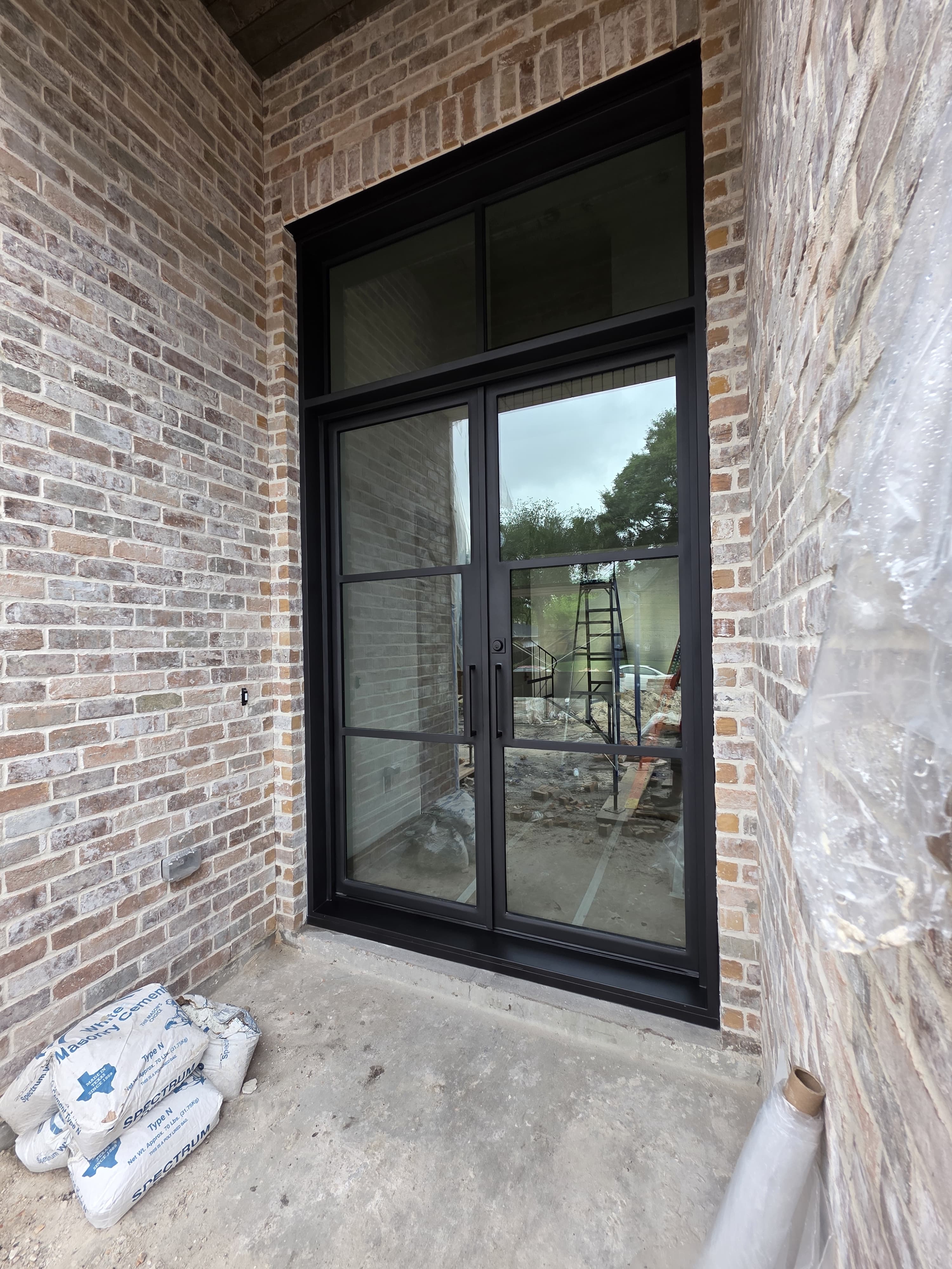 Tall modern iron single entry door